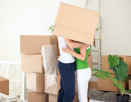 Professional moving help loading furniture into a van