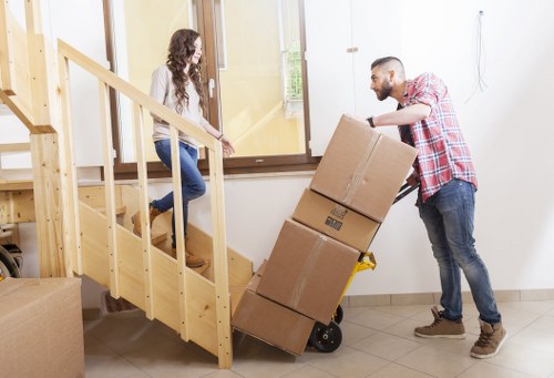 Household moving preparation with labeled boxes in Queensbury